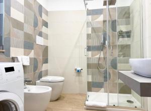 a bathroom with a shower and a toilet and a sink at B&B Il Tramonto in Capo dʼOrlando +116 photos