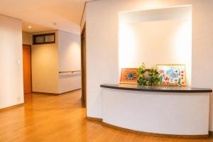 a lobby with a reception counter in a building at Sumomo in Takayama
