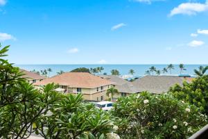 a view of a city with trees and houses at Kona Mansions#208 in Kailua-Kona