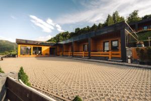 a house on the side of a mountain at Panoramic Residence in Borşa