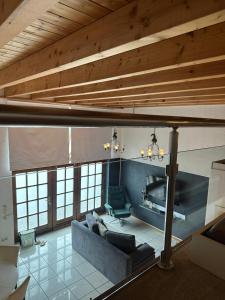 a living room with a couch and a chair at Ferienwohnung Loft ca. 45 qm in Anröchte +2 photos