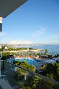 a view of the beach from the balcony of a resort at Vila Inheritor in Shëngjin