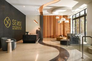 an office with a lobby with a reception desk and chairs at Sense28 Edgewater, an AvantStay Hotel in Miami +43 photos