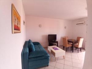 a living room with a couch and a table at Apartmani Blažević in Zaglavice