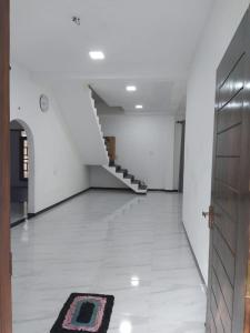 a hallway with a staircase and a rug on the floor at Dil villa in Habaraduwa Central