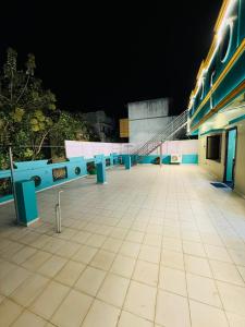 a night view of a building with a staircase at Eden Villa in Virāmpattinam