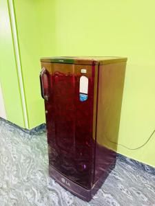 a suitcase is sitting on the floor in a room at Eden Villa in Virāmpattinam +14 photos