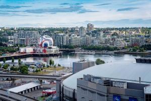 a view of a city with a river and buildings at Gorgeous Unit with City Views in Vancouver