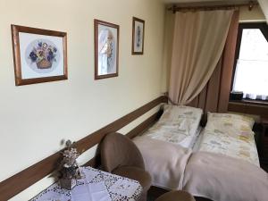 Posteľ alebo postele v izbe v ubytovaní Przed Tatrami