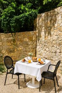 a table with a plate of food on it at Villa Shelegar in (( Metoq ))