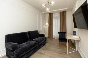 a living room with a couch and a table at Leomare in Odesa