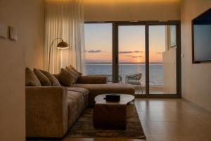 a living room with a couch and a view of the ocean at شقق برج داماك جدة Damac Jeddah in Jeddah