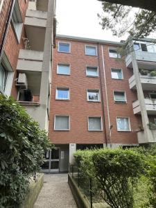 an apartment building with a walkway in front of it at Sea & Books Studio in Trieste