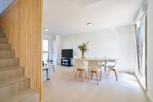 a kitchen and dining room with a table and chairs at Sun&Fun Villa in Vinarós