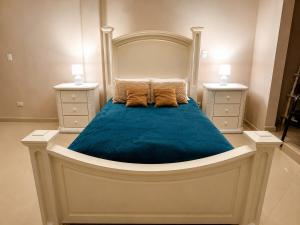 a bedroom with a large bed with two night stands at Casa Di Manuelito in Monterrey