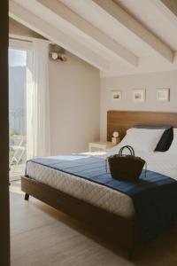 a bedroom with a bed with a basket on it at Hortus Bellagio in Bellagio