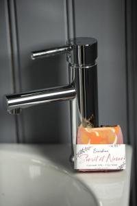 a bathroom sink faucet with a bar of soap on it at The Barraghan in Derrygonnelly +23 photos