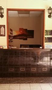 a counter in a building with a window at Hostal Chordeleg in Cuenca