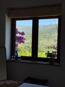 a window with a view of a mountain view at Casa BuganVilla de Gredos in Mombeltrán