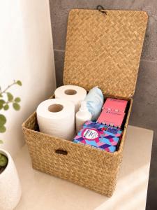 a basket with toilet paper and toilet paper rolls at Glamping Tisá in Tisá +26 photos