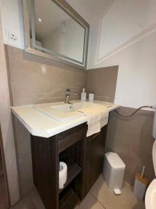 a bathroom with a sink and a toilet at 3 bedroom Apartman Izolana in Izola +8 photos