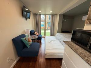 a small living room with a bed and a tv at PPI Native American Theme suite in Medicine Park +51 photos
