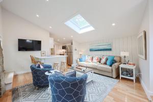 a living room with a couch and a table at Granite Cottage in Rockport