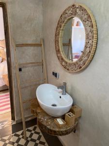 a bathroom with a sink and a mirror at laurier Rose Hostel in Ourika +56 photos