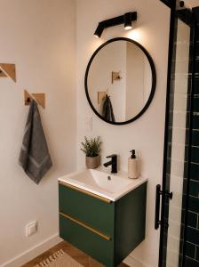 a bathroom with a sink and a mirror at Osada Przejrzysko in Jordanów +20 photos