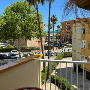 a balcony with a view of a parking lot at Playa del Ter in Platja de l'Arenal +3 photos