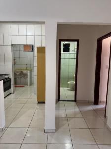 a bathroom with a toilet and a sink at Prédio Solar da Serra in Parauapebas +9 photos