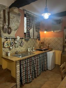 a kitchen with a sink and a counter top at Casa Venusia in Alatri
