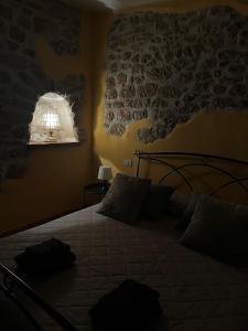 a bedroom with a bed with a map on the wall at Casa Venusia in Alatri