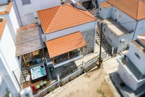 an overhead view of a house with an orange roof at Villa Arty in Limenaria