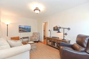 a living room with a couch and a table at Pigeon Hill in Rockport