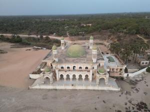 an aerial view of a mosque with a green dome at Baraka Nema Villa Resorts in Gunjur