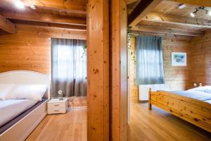 a bedroom with two beds and a window at Feel Good Place in Fritzens
