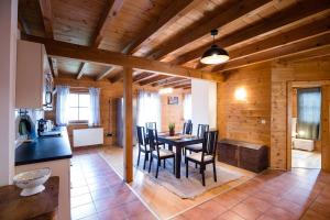 a kitchen and dining room with a table and chairs at Feel Good Place in Fritzens
