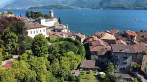 a town on a hill next to a body of water at Civico Cinque in Gravedona