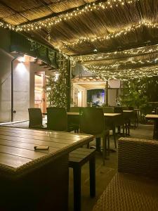 a restaurant with tables and chairs and lights at Locanda B&B Da Nati in Arba