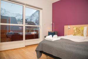 Säng eller sängar i ett rum på Fast Hotel Lofoten