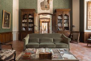 a living room with a couch and a table at Château du Grand Pré in Vitrolles-en-Luberon