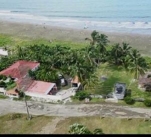 an aerial view of a house on the beach at PlayaMariaChiquita in Colón