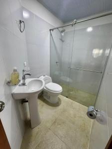 a bathroom with a toilet and a sink and a shower at Sofi House Zap in Zapatoca +5 photos