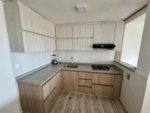 a kitchen with a sink and a counter top at Sofi House Zap in Zapatoca