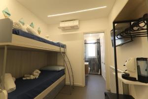 a bedroom with a bunk bed with a teddy bear on it at B&Suite Le Meraviglie in Terrasini +8 photos