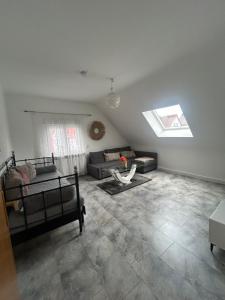 a living room with two beds and a couch at Adler Haus in Neunkirchen