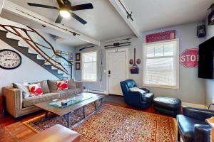 a living room with a couch and a table at Cozy Cottage w/ Hot Tub in Freeland, Pets Welcome! in Freeland