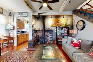 a living room with a couch and a table at Cozy Cottage w/ Hot Tub in Freeland, Pets Welcome! in Freeland
