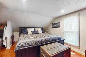 a bedroom with a bed and a window at Cozy Cottage w/ Hot Tub in Freeland, Pets Welcome! in Freeland
